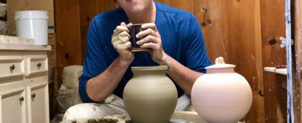 Charles LaFond, potter, with pots he has made